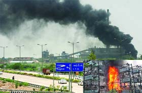 Smoke emanates from a power substation near the Rajghat that caught fire on Sunday morning