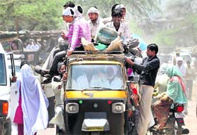 Throwing traffic rules to the wind: The plying of overloaded autorickshaws like this one is routine at Nuh in Mewat district