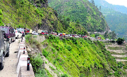 Amarnath cave shrine-bound vehicles stranded at Ramsoo on the Jammu-Srinagar National Highway on Sunday