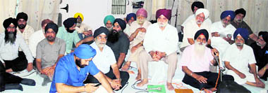 Members of the Chief Khalsa Diwan during the Sikh organisation's general house meeting in Amritsar on Sunday.