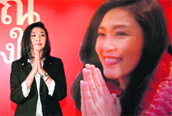 Yingluck Shinawatra, sister of ousted premier Thaksin Shinawatra, arrives at the partys headquarters in Bangkok on Sunday.