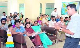 Dr Raj Setty addresses a gathering in Panchkula