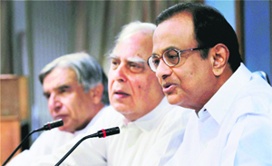 Home Minister P Chidambaram, HRD Minister Kapil Sibal and Parliamentary Affairs Minister Pawan Kumar Bansal at a press conference in New Delhi on Monday. 