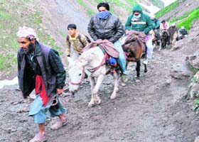 Ponywalas carry pilgrims to the Amarnath cave shrine on Monday
