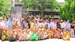 Residents of Jandiali village stage protest outside the police commissioners office in Ludhiana