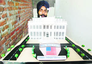 Paper artist Gurpreet Singh shows a model of the White House on the occasion of US Independence Day in Amritsar. Photo: Vishal Kumar