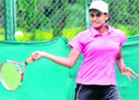 Power play Tanushree Vele of Tamil Nadu plays a shot during the CLTA-AITA Tennis Tournament in Chandigarh on Tuesday. She beat Salim Saleema 6-3, 6-1. 