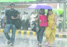 Delhiites caught in the rain on Tuesday