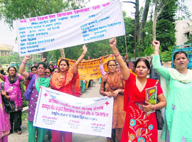 ASHA workers hold a protest in Dehradun 