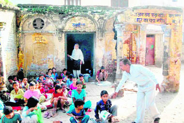 Children of Government Primary School No. 5, Jwalapur, study in the open. 