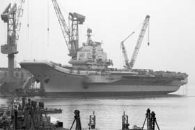Aircraft carrier Varyag that China bought from Ukraine under refit at a Chinese port. It will add to a growing military clout just as other powers in Asia are becoming uneasy about Beijing's more strident claims over disputed seas in the region