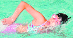 Barqat swims towards the finish line to secure the first position in the girls U-14 100m event during a competition at the All-Weather Swimming Pool Centre in Chandigarh on Wednesday. 