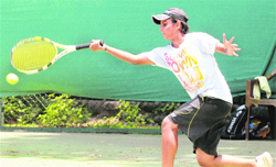 Samriti of Delhi plays a shot against her opponent during the ongoing CLTA-AITA Tournament in Chandigarh on Wednesday. 