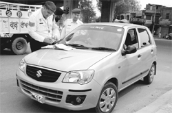 A traffic cop issues a challan to a violator in Zirakpur.
