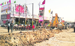 A JCB machine digs a trench to close illegal access to the Zirakpur-Ambala highway. 