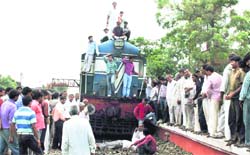 Residents of Hayatpur and other nearby villages block rail traffic at Garhi Harsaru railway station in Gurgaon