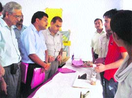 Judges examine science models put on display at a district-level exhibition in Udhampur on Wednesday. 