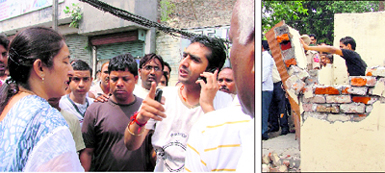 (Left) Councillor Satish Nagar (on phone) argues with Assitant Town Planner Kamaljit Kaur during the demolition drive at Chawni Mohalla in Ludhiana on Wednesday. (Right) A resident of the area demolishes his own structure during the demolition drive
