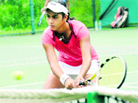 A player awaits to return a shot at the AITA-CLTA Tennis Championship in Chandigarh on Thursday