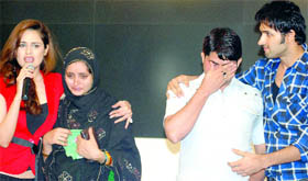 A couple from Adoli village in Bulandshahr break down as they narrate their story of exile from the village due to death threats by the khap panchayat at a promotional event for a film, Khap, held in New Delhi on Thursday.