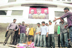 Members of the ABVP burn posters of Delhi Belly at a cinema house in Dehradun on Thursday.