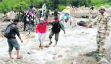 A jawan guides Kailash Mansarovar pilgrims on Thursday.
