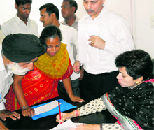 Union Minister for Poverty Alleviation Kumari Selja listens to grievances of public at her camp office in Ambala