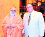 Michael Montesano (right), Assembly member, joins spiritual leader Brahmrishi Kumar Swami in the New York State Senate Chamber