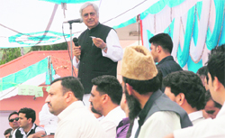 Former Chief Minister Mufti Mohammad Sayeed addresses a public rally in Rajouri on Thursday.