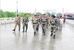 Army officers cross the bridge after its inauguration in Aknoor on Thursday. 