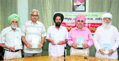 Principal of Lyallpur Khalsa College Dr Jaspal Singh Randhawa releases a book of Dr Harjinder Singh during a function on the college campus in Jalandhar. 