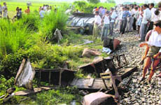 The accident site where a train rammed into a bus at an unmanned crossing near Dariyawganj in Kanshiram Nagar of Uttar Pradesh on Thursday.