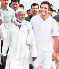 AICC general secretary Rahul Gandhi interacts with Kirpalpur villagers during the third day of his padyatra in Uttar Pradesh on Thursday.