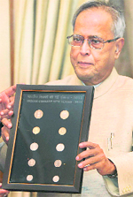 Union Finance Minister Pranab Mukherjee releases a new series of coins of the denomination of 50 paise, Rs 1, 2, 5 and 10 in New Delhi on Friday