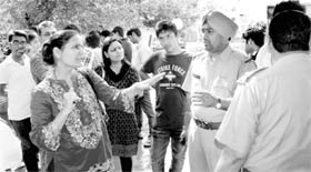 Relatives of Pankaj Chaudhary, a clash victim, argue with the police at the Sector 10 police station in Panchkula on Saturday.