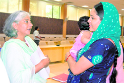 One of the interlocutors, Prof Radha Kumar, speaks to a woman panch from the remote Gulabgarh area of Reasi district after the meeting on Saturday