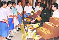 Schoolchildren getting cookery tips during Tomato Fiesta organised at GGNIMT in Ludhiana on Saturday