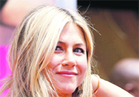 Actress Jennifer Aniston waves after her hand and footprint ceremony at the Graumans Chinese Theatre.