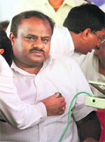 A doctor examines JD(S) leader HD Kumaraswamy in Bangalore