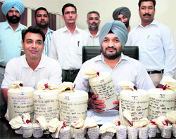 Counter-intelligence officials with the seized contraband in Jalandhar