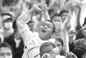 Supporters of the "Bersih" (Clean) electoral reform coalition shout slogans during an anti-government rally in Kuala Lumpur 