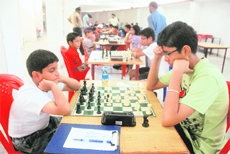 Participants plan their next move during a chess competition at Sector 44 in Chandigarh on Sunday.
