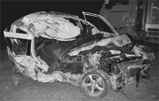The mangled remains of the car that met with an accident near the Morni turn on National Highway 73 on Sunday