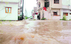 A flooded street at Patel Nagar in Dehradun on Sunday. 