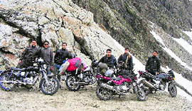 Members of the bikers team on the Saach Pass (4413 m)