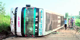 A view of the overturned Volvo bus.