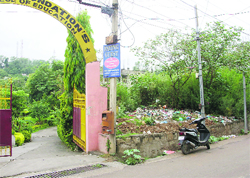 A plot adjoining a college, which is being used a dumping ground, at Shiv Nagar in Udhampur