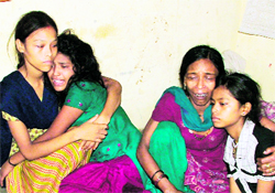 The grieving family members of Kamal Kumar who died in a fire in Ludhiana on Sunday