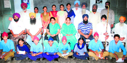Students, who were honoured, strike a pose in Mandi Ahmedgarh