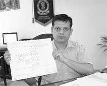 Secretary (Revenue), Punjab, Anurag Verma shows a printout of computerised jamabandi in Patiala on Sunday